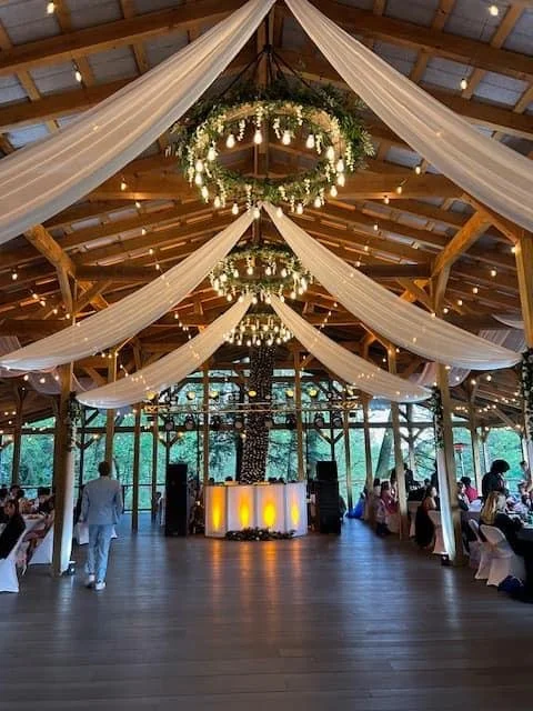 Cherry Run Lodge — interior with draped fabric ceiling and chandeliers